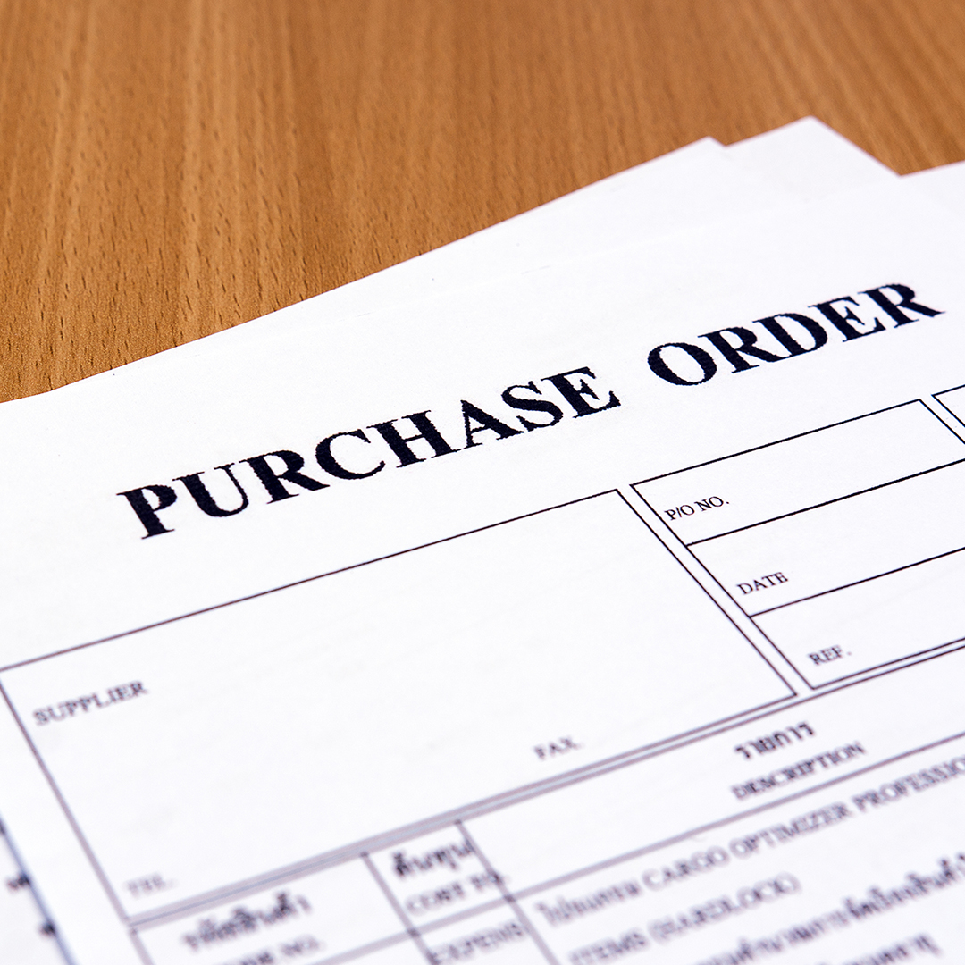 Purchase order form on wooden table