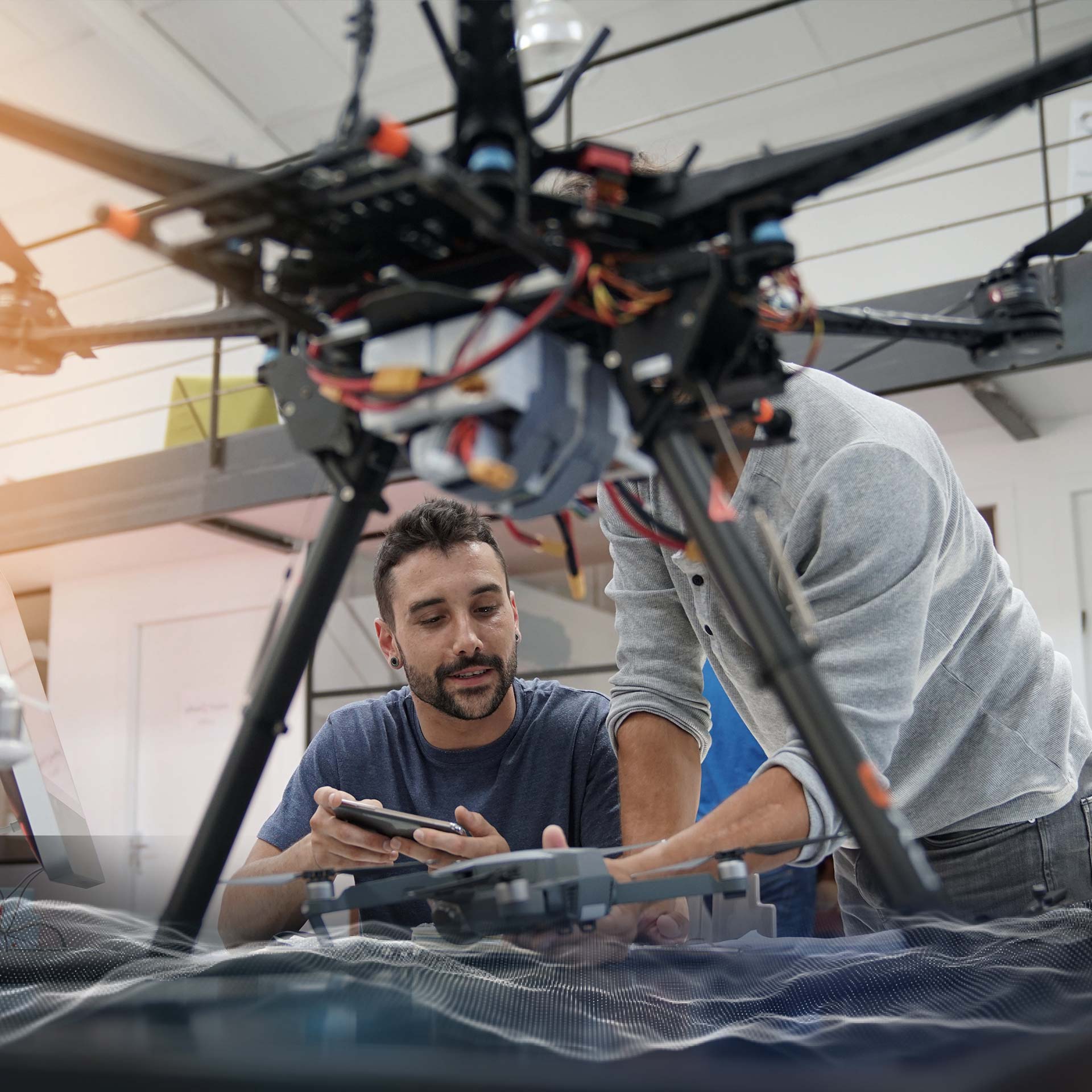 tweaking drone in high tech manufacturing lab