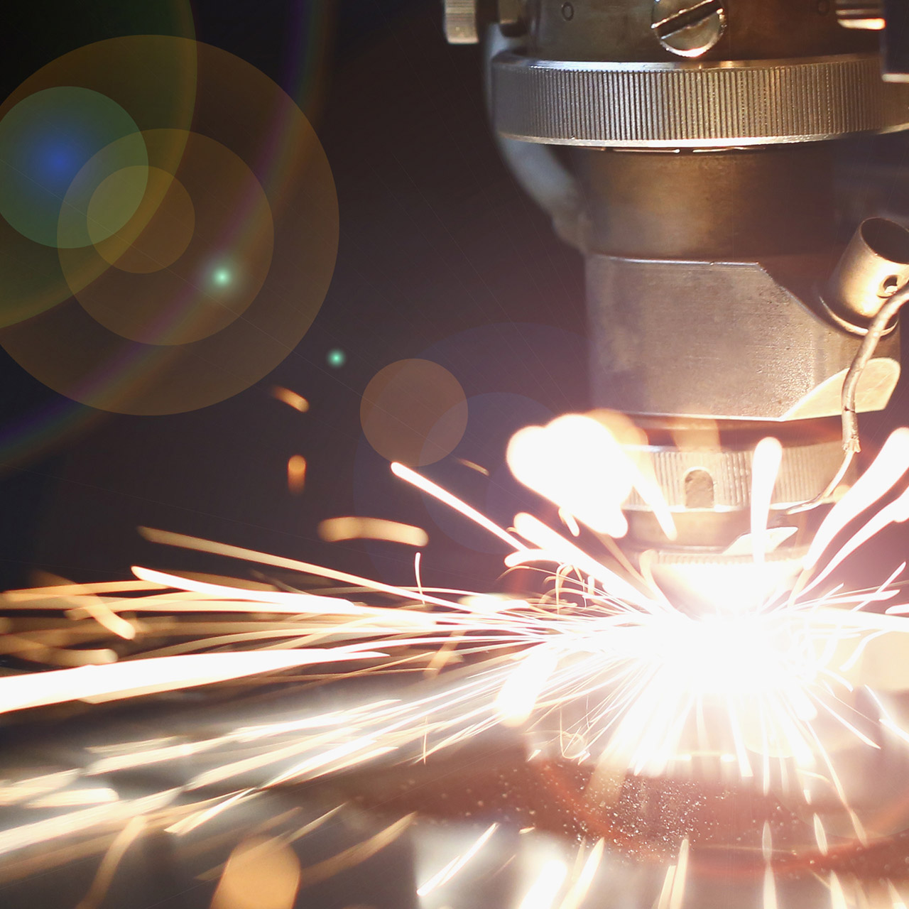 Sparks fly out machine head for metal processing