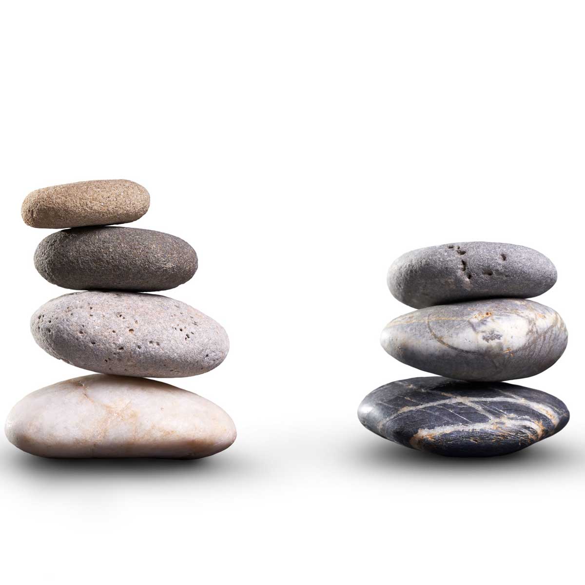 A collection of pile of stones isolated on a white background