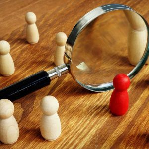 Talent acquisition and management. Magnifying glass and gavel. 