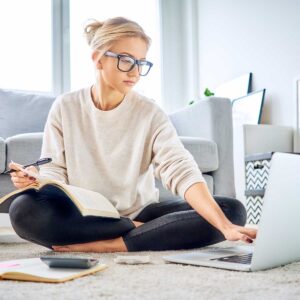 Woman using laptop and managing business budget