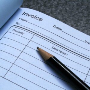 invoice-imagery;-invoice-sheet-of-paper-not-filled-in;-pencil-sitting-on-top-of-sheet
