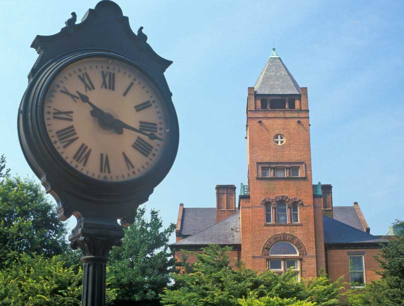View of a Red Brick Courthouse and clock tower during the day in Rockville, Maryland